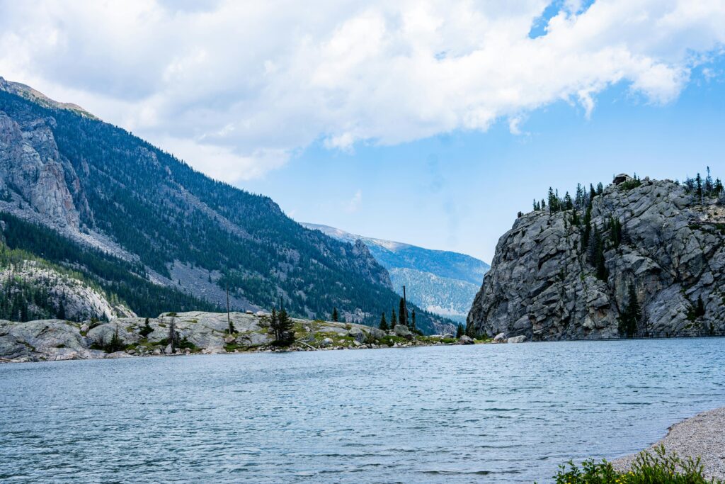 Landscape of Billings, Montana featuring a lake and mountains in the background